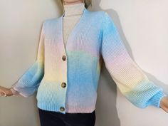 This is a rainbow knit sweater for women. This colorful cardigan is thin knitted but it feels loose because of its soft and delicate yarn so it's very lightweight knitwear. It keeps your body warm in winter or fall. There are three buttons on the front side. This handknit cozy sweater is a multipurpose outfit for both your casual usege and special days. Other sizes will be added. Multipurpose Outfit, Colorful Cardigan, Colored Cardigans, Pullover Outfit, Long Torso, Women Sweater, Knitting Women Sweater, Body Warmer, Cozy Sweater