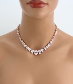 Amazing Rose gold back necklace created with sparkly Cubic zirconia stones that sparkle like diamonds ! Perfect for any bride or special occasion. Created with Swarovski Pure Brilliance stones. Available in rose gold, yellow gold or rhodium (silver) finishes. Necklace measures 16 inches and extends to 18 inches Backdrop measures 7 inches Matching bracelet: https://www.etsy.com/listing/594245340/rose-gold-bracelet-bridal-bracelet?ref=shop_home_active_1 Matching earrings: https://www.etsy.com/list Rose Gold Backdrop, Bridal Backdrop Necklace, Bridal Statement Necklace, Diamond Circle Necklace, Backdrop Necklace, Gold Backdrop, Backdrops Necklace, Accessoires Iphone, Diamond Necklace Designs