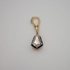 "Lower prices on our main website: https://discomarshmallow.myshopify.com/ This Georgian Victorian Ball Chain Pendant is adorned with a 3-carat kite-shaped moissanite in a Georgian cut-down collet setting. This is exquisitely handcrafted in 18k blackened gold and your choice of 18k yellow or rose gold. Designed with the spirit of versatility, it gracefully hangs from any of our ball chain necklaces, making it a true testament to the fusion of history and modern elegance. Item Details * Made to O Luxury White Diamond-shaped Jewelry, Luxury Diamond White Jewelry With Diamond Markers, Luxury Diamond-shaped Jewelry With Diamond Accents, Luxury Diamond Jewelry With Diamond Markers, Luxury Diamond White Jewelry With Detachable Pendant, Luxury Diamond White Diamond-shaped Jewelry, Luxury Octagon Single Diamond Jewelry, Luxury Yellow Gold Jewelry With Diamond Markers, Luxury Octagon Moissanite Jewelry