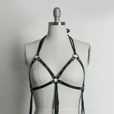 "High quality, durable, body-conscious fashion harness cage bra made in thick, strong PVC. Fit is adjustable with long gauze ties at the back and neck for a halter style fit. Silver-toned nickel plated steel hardware. Additional shredded and ripped gauze fringe details at front and sides for badass post-apocalyptic style. Inspired by the ring wraiths / Nazgul, ghosts, dystopian neopunk style, and things that haunt the forests (or maybe just the club). Available colors: Black Translucent Smoke Tr Diy Body Harness, Wasteland Fashion, Body Conscious Fashion, Bra Harness, Gothic Accessories, Leather Harness, Pvc Vinyl, Halter Style, Post Apocalyptic