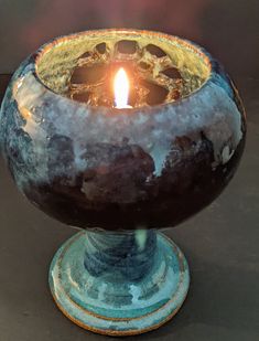 a candle that is sitting in a bowl