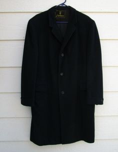 Vintage Michaels Stern Rochester 100% Cashmere Men's Black Overcoat  shoulder to shoulder: approx. 19" pit to pit: approx. 23.5" center back length: approx. 42" 3 button front closure pre-owned the stitching on the label is a little loose - (see second to last photo) the end of the liner on the inside has a few tears - (see last photo) good condition overall picture is for actual Classic Black Winter Sport Coat, Black Notch Lapel Sport Coat For Winter, Black Wool Long Sport Coat, Black Wool Sport Coat, Black Long Sport Coat For Business, 1950s Men, Black Overcoat, Overalls, Cashmere