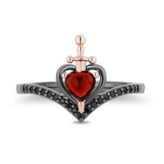 From the Enchanted Disney Fine Jewelry Villains Collection inspired by the Evil Queen, this devious heart-shaped red garnet and black diamond dagger ring is on the cutting-edge of fashion. Crafted in sterling silver with black rhodium plate The chevron-shaped band glistens with alluring black diamonds. Poised at the center, a 10K rose gold dagger pierces a 5.0mm heart-shaped regal red garnet set inside an open heart-shaped frame. 1/6 ct. t.w. of diamonds This ring is available in size 7 only. ©Disney Eclectic Rings, Enchanted Disney, Enchanted Jewelry, Queen Rings, The Evil Queen, Enchanted Disney Fine Jewelry, Disney Fine Jewelry, 2024 Wishlist, Heart Shaped Frame