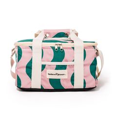 a pink and green striped lunch bag with white straps on the front, sitting against a white background