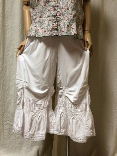 Spring Loungewear Pants With Ruffles, Stretch Cotton Bottoms With Ruffle Hem, Cotton Ruffled Bloomers, Casual Rayon Bottoms With Ruffles, Casual Ruffle Bottoms In Rayon, Spring Daywear Rayon Pants, Wide Leg Ruffled Pants For Loungewear, Wide Leg Ruffle Pants For Loungewear, Spring Capri-length Harem Pants