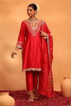 Crimson red kurta featuring gota pati and pearl embellished neck with scallop hem detailing. Paired with a scallop hem pant and a dupatta. - Aza Fashions Red Dupatta With Dabka Work, Elegant Red Kurta With Dori Work, Elegant Red Kurta For Navratri, Red Kurta With Gota Work For Party, Red Party Kurta With Gota Work, Red Gota Work Kurta For Party, Red Silk Sharara With Mirror Work, Fitted Red Sharara With Gota Work, Fitted Red Traditional Wear With Mirror Work