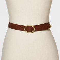 Style your waist with this Black Oval Buckle Belt from Universal Thread™. This women's black belt makes a versatile choice in your accessories collection. Designed with a gold oval buckle for classic flair, it sports a durable faux-leather finish for easy care. This stylish belt with loop holes gives a secure fit to all your outfits. Pair this solid belt with anything from casual jeans to formal trousers to skirts to effortlessly accessorize your go-to look. Womens Black Belt, Cowgirl Look, Baggy Sweaters, Tan Belt, Nice Belts, Formal Trousers, Leather Finish, Reversible Belt, Brown Belt