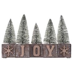 a wooden sign that says joy with snowflakes on it and trees in the background