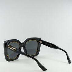 Indulge in the luxury and sophistication of Gucci with the stunning GG1151S 001 Black/Grey sunglasses. These iconic butterfly-shaped frames exude elegance and style, perfect for the fashion-forward woman who wants to make a statement. Crafted from high-quality acetate, the black frame is sleek and modern, while the grey lenses add a touch of mystery and allure. The classic color combination of black and grey never goes out of style, making these sunglasses a timeless addition to your accessory collection. With a lens socket width of 51mm and a bridge size of 23mm, these sunglasses are designed to fit comfortably and securely on your face. The temple length of 145mm ensures a perfect fit for all-day wear, whether you're running errands or lounging by the pool. The Gucci GG1151S 001 Black/Gr Elegant Sunglasses With Tinted Square Lenses, Classic Party Sunglasses With Tinted Lenses, Elegant Square Frame Sunglasses With Tinted Lenses, Classic Tinted Sunglasses For Party, Classic Tinted Sunglasses For Parties, Elegant Square Frame Tinted Sunglasses, Trendy Formal Sunglasses With Gradient Lenses, Sleek Square Frame Sunglasses For Party, Modern Gucci Cat Eye Sunglasses With Uv Protection