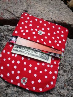 "A cherry business card holder with lots of storage. This small wallet has 2 slots for business cards, credit cards, ID's & folded cash. This little wallet will expand....I know because I use it for my business cards! The flap & backside is made of a pretty black & white gingham cotton print with bright red cherries. I have paired it with a red & white polka dot print. It stays secure with a pearl snap (which may vary in color). It has a layer of sturdy interfacing & has been Gift Bifold Card Holder With Zipper Pouch, Pocket Wallet, Business Card Holder, Business Card Holders, Small Wallet, Polka Dot Print, Dot Print, White Polka Dot, Bright Red