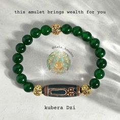 The Kubera Dzi Bracelet is a powerful Tibetan talisman that attracts and maintains wealth. The bead carries the energetic power of the God of Wealth, Kubera or Dzambala, and assists you in building and preserving great wealth. The accumulation of wealth with this bracelet happens harmoniously and goes hand in hand with the development of your spiritual powers. It promotes luck in financial matters and the recognition of others. This bracelet is ideal for building up financial cushion, be it for big dreams like traveling the world or buying several houses, or for security in everyday life. The Kubera Dzi bracelet allows you to advance your career and enjoy a sense of security and stability. It gives you the confidence to take on challenges and risks while being financially secure. Famous ac Spiritual Polished Beads Bracelets For Meditation, Spiritual Bracelets With Polished Beads For Meditation, Traditional Bracelets With Natural Stones For Meditation, Spiritual Good Luck Beaded Bracelets, Handmade Spiritual Bracelets For Rituals, Spiritual Bangle Bracelets For Blessing, Traditional Round Beads Healing Bracelet, Spiritual Bangle Bracelet With Polished Beads, Traditional Hand-strung Good Luck Bracelets