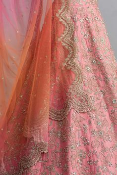 Powder pink organza lehenga with cutdana work, floral jaal motifs and cutwork hem. Comes with embellished blouse and ombre pink-organza scallop border dupatta.
Components:3
Embroidered
Neckline:Square
Sleeve Length:Half
Fabric:Lehenga: Organza; Dupatta: Net
Color:Pink
Scallop dupatta
Tie-up cutout back
Kamar tassels
Cutwork detail
Note: Cancan worn by the model is not for sale - Aza Fashions Festive Tissue Silk Lehenga With Intricate Embroidery, Organza Lehenga For Festivals, Semi-stitched Organza Lehenga For Festivals, Festival Organza Choli With Intricate Embroidery, Pink Chanderi Lehenga With Intricate Embroidery, Organza Gown With Pallu For Festivals, Organza Lehenga With Intricate Embroidery For Festivals, Pink Fitted Silk Thread Lehenga, Organza Choli With Resham Embroidery For Festivals