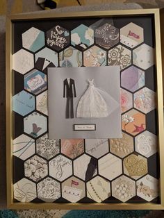 a wedding photo frame with many different types of paper and magnets on the wall