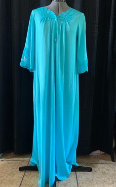 Bright blue with embroidered details, size S but fits me at an XL Blue Long Sleeve Bedtime Dress, Blue Nightgown For Spring Loungewear, Blue Long Sleeve Nightgown For Sleepover, Long Sleeve Blue Nightgown For Sleepover, Light Blue Long Sleeve Nightgown For Spring, Blue Cotton Sleepwear With Lace Trim, Light Blue Long Sleeve Nightgown, Blue Long Sleeve Hospital Nightgown, Light Blue Long Sleeve Nightgown For Sleep