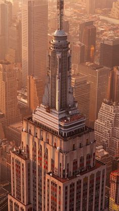 an aerial view of the empire building in new york city, ny at sunrise or sunset