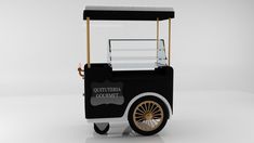 a black and white cart with gold rims on the wheels that reads gutteria cookie