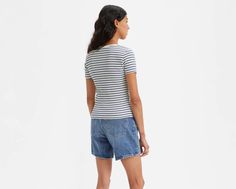 It may look like a T-shirt, but upon closer inspection, our Britt Snap-Front Top is anything but. With snap button closure and a slim fit through the body and sleeve, this supersoft top tucks into a pair of Levi's® denim with ease. Slim fit through the body and sleeves Features a snap button closure Levi's Casual Stretch Tops, Levi's Crew Neck Tops For Summer, Fitted Spring T-shirt With Button Closure, Fitted Levi's Cotton T-shirt, Levi's Fitted Cotton T-shirt, Levi's Stretch Tops For Spring, Fitted Casual T-shirt With Button Closure, Fitted Levi's Cotton Top, Levi's Cotton Tops With Button Closure