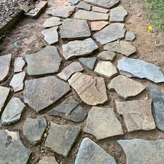 a stone path in the middle of a field