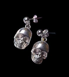 Skull Drop Stud Earrings * Gothic Alternative Punk Emo Fashion Accessories Jewellery Add a unique touch to your everyday style with our new jewellery collection. These edgy skull pendant stud earrings are a bold choice.  Colour: Silver Stud Material: Copper Alloy Skull Pendant Material: Zinc Alloy This product is made especially for you as soon as you place an order, which is why it takes us a bit longer to deliver it to you. Making products on demand instead of in bulk helps reduce overproducti Edgy Nickel-free Skull Earrings, Edgy Skull-shaped Earrings For Gift, Edgy Skull Shaped Earrings For Gift, Edgy Pierced Skull Jewelry, Edgy Skull-shaped Pierced Earrings, Edgy Nickel-free Skull Jewelry, Silver Skull Earrings With Skull Print, Nickel-free Skull Earrings In Punk Style, Earrings Gothic