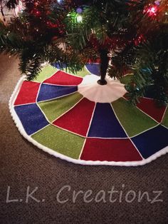 a christmas tree skirt is sitting on the floor