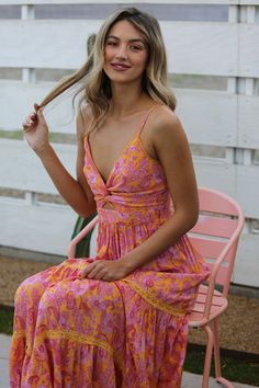 Get ready to turn heads with the Marlow Boho Cut-Out Maxi! This stunning dress features a boho-inspired design that's perfect for any occasion. Embrace your free-spirited side with the flowy maxi cut, while showing off a playful side with the unique details. Make a statement in this must-have addition to your wardrobe. Adjustable spaghetti straps V-neck with twist detail Cut-out detail Smocked back 100% Rayon True to size- Small (2/4) Medium (6/8) Large (10/12) Model is shown wearing a size smal Marigold Dress, Maxi Dress Boho Chic, Sun Dresses, Cutout Maxi Dress, Maxi Dress Sale, Rose Boutique, Summer Maxi, Floral Print Maxi Dress, Pink Maxi Dress