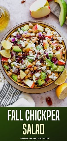 a bowl filled with salad next to sliced apples