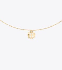 Miller Pendant Necklace: Women's Designer Necklaces | Tory Burch Classic Gold Chain Necklace With Logo Charm, Classic Gold Necklace With Logo Charm, Gold-tone Chain Necklace With Logo Charm As Gift, Classic Yellow Gold Necklace With Logo Charm, Yellow Gold Medallion Necklace With Logo Charm, Gold Medallion Necklace With Logo Charm, Gold Pendant Chain Necklace With Logo Charm, Classic Necklace With Logo Charm On Round Pendant, Classic Necklaces With Round Pendant And Logo Charm