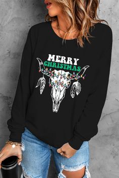 Black Merry Christmas Steer Skull Print Graphic Sweatshirt Black Long Sleeve Christmas T-shirt, Black Winter Holiday T-shirt, Casual Winter Tops With Skull Print, Casual Skull Print Tops For Winter, Casual Halloween Holiday Tops, Winter Skull Print Relaxed Fit Tops, Relaxed Fit Skull Print Tops For Winter, Casual Black Christmas Sweatshirt, Winter Black Tops With Skull Print