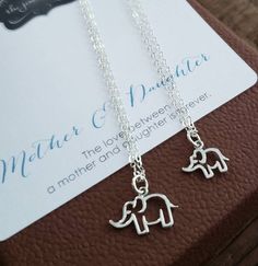 perfect charm to celebrate beautiful motherhood. openwork elephant charm necklace set.925 sterling silver ifnish.16-18'' adjustable chain.mother elephant charm-18x15mmbaby elephant charm-15x13mm Mother Elephant, New Mommy Gifts, Elephant Charm Necklace, Mother Daughter Jewelry, Mom Daughter Gifts, Baby Elefant, New Mommy, Mama And Baby, Mommy Gift