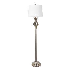 a floor lamp with a white shade on it