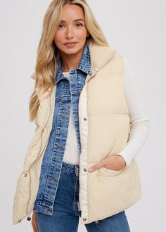 This trendy Sloane Puffer Vest is perfect for adding warmth and style to your wardrobe. With a padded design, denim layered button up front, and zip up closure, it's both functional and fashionable. The high collar adds extra protection against the cold. Available in a relaxed fit, suitable for sizes S/M. Game Day Shirts, Crop Top Sweater, Mom Tees, Crop Top Blouse, Romper Dress, Fall Shopping, Puffer Vest, Blazer Coat, High Collar