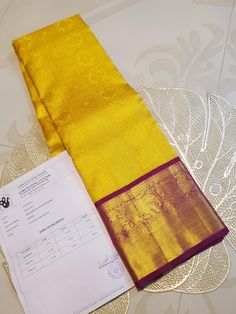 For any questions Whatapp Us: +4591718558 Visit www.silktatva.com for extra discounts Golden Yellow and Pink Kanchipuram/Kanjivaram Handloom 2 Gram Pure Gold Zari Pattu Silk Saree Elevate your style with our Handwoven Kanjivaram Silk Saree. This saree comes with Zari testing certified, ensuring the highest quality and authenticity. Beautiful saree with all over Traditional Zari buttas in the body of the saree Borders in contrast color with zari weaving Heavy Pallu with full Zari weaving 2 Gram P Silk Mark Certified Paithani Silk Traditional Wear For Wedding, Silk Mark Certified Tussar Silk Traditional Wear For Festivals, Festival Tussar Silk Traditional Wear With Silk Mark, Festive Silk Mark Certified Traditional Wear For Puja, Silk Mark Certified Raw Silk Traditional Wear For Festivals, Silk Mark Certified Traditional Wear For Puja And Festivities, Traditional Silk Wear With Silk Mark Certification, Traditional Tissue Silk Saree With Silk Mark Certification, Gold Traditional Wear Silk Mark Certified For Festivals