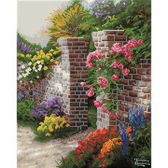 a brick wall with flowers growing on it