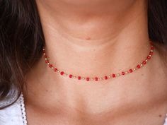 This modern stacking  chocker necklace is made with Gold Plated Rosary Chain adorned with Red Cristal Glass Beads. ➵ Perfect to wear as Chocker or Double turn Bracelet.➵ The necklace length is ajustable thanks to 5 cm extender chain.--*--*--*--*--*--*--*--*--*--*--*--*--*--*--*--*--*--*--∞ SIZE ∞- length: 32 cm (12,6 in) to 37 cm (14,6 in) with the little extender chain.Closing-system : Adjustable∞ MATERIAL ∞- Gold plated over brass- Cristal BeadsNickel free jewelry !∞ COLOR ∞- Gold- Red--*--*-- Trendy Red Choker For Party, Trendy Red Party Choker, Trendy Red Beaded Necklace For Party, Trendy Red Choker As Gift, Trendy Red Jewelry With Adjustable Chain, Dainty Faceted Bead Choker Necklace, Red Dainty Jewelry With Round Beads, Trendy Red Necklaces With Round Beads, Dainty Red Round Bead Jewelry