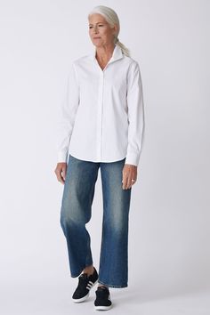 With a tailored look yet an ease of fit, our Box Pleat Ginna shirt is made for women on the move. A unique single piece collar construction can be worn up or softly folded befitting your mood. Back box pleat, center front exposed button closure, classic cuff length, sleeve placket detail, and signature loop detail. - 83% Cotton, 14% Polyamide, 3% Elastin - Made in NYC - Dry clean or machine wash - Our model is 5'9.5" wearing size 4 - Chest Width 40", Hip Width 45", Length 28" Orders are processed within three business days (not including weekends or holidays). All pre-orders are charged at the time of purchase and shipped on the date indicated on each style. All returns are subject to a per order restocking fee. Please visit the RETURNS/EXCHANGES page to review our policies regarding retur Classic Blouse With Relaxed Fit And Fold Down Collar, Classic Tops With Straight Hem, Timeless Relaxed Fit Shirt For Office, Classic Everyday Blouse With Fold Down Collar, Classic Blouse With Fold Down Collar, Classic Blouse With Fold Down Collar For Everyday, Modern Shirt With Relaxed Fit And Fold-down Collar, Classic Fitted Blouse For Everyday, Elegant Tops With Fold Down Collar For Everyday