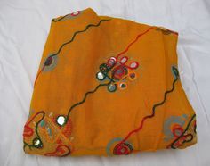 Pattern - embroidered sequin scarf. Ideal for - women/ girls. Occasion - formal or casual. Fabric - cotton. It has an embroidered floral pattern all over. This piece is from the Kutchh area of Gujarat. It is hand-painted and embroidered. Color - On a yellow background, embroidery is done with different colored threads and mirror sequins. Plastic sequins are used because they are lightweight. Size - 40 x 84 inches(approx). Care - gentle hand wash. For more such scarves please visit- https://www.e Sequin Scarf, Beige Scarf, Woolen Scarves, Embroidered Scarf, Yellow Scarf, Boho Scarfs, Green Scarf, Large Scarf, Scarf Gift