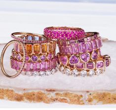 Our oval pink sapphire eternity bands, set in 14K or 18K yellow, rose, and white gold with 6 x 4 mm shimmering pink sapphires. The eternity of pink sapphires spans the entire band. Wear these alone or stacked with multi-colors and/or other rings from our collections. We have varying sizes in stock, you can order to your specific size of sapphires or other colors of gemstones. Most of our special order eternity bands can be completed with in a few days to five weeks. 14K Gold or 18K gold 7-8 cts pink sapphires 20 pink sapphires (depending upon ring size) 6 x 4 mm pink sapphires, oval cut 4 grams gold U shape prong setting Available in rose, yellow, or white gold Made in Los Angeles Complimentary gift wrapping Please email us with special orders Colored Wedding Band, Sapphire Eternity Band, Dope Jewelry Accessories, Bezel Set Earrings, Signature Bracelet, Diamond Stacks, Bridal Diamond Jewellery, Pink Sapphire Ring, Dope Jewelry