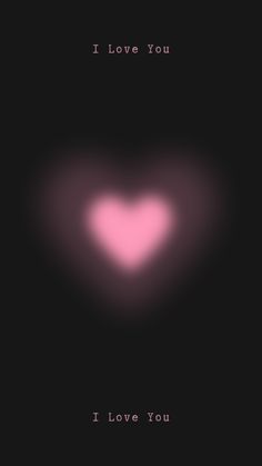 a heart shaped object with the words i love you written in pink on black background