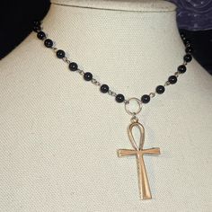 Large Ankh Cross Pendant Choker Necklace. Made With Black Glass Beads & Finished With Chain In The Back. Measures Approximately 14 Inches. Has A Lobster Clasp And 1.5 Inch Extension Chain. #Rosary #Choker #Cross #Goth #Grunge Nickel Free Black Beaded Necklaces, Nickel-free Black Beaded Necklace As Gift, Nickel-free Black Beaded Necklaces With Round Beads, Nickel-free Black Beaded Necklace Gift, Nickel-free Black Beaded Necklace, Nickel-free Black Beaded Necklace For Gift, Black Metal Necklaces With Silver Beads, Black Metal Necklace With Silver Beads, Black Necklace With Silver Beads