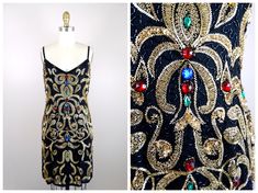 "This is a stunning vintage couture piece! It's heavily embellished with glass beading and sequins all over and accented with colorful jewels. It's in perfect condition! Size MEDIUM Measurements: Bust - 34/36\" Waist - 27/29\" Hips - 36/38\" Dress Length - 36\" Size LARGE Measurements: Bust - 36/38\" Waist - 29/31\" Hips - 38/40\" Dress Length - 38\" All of my items come from a smoke-free and pet-free home. If you would like more info or have any questions, please don't hesitate to ask!" Embellished Sequin Fabric For Evening Dress And Festive Occasions, Embellished Sequin Fabric For Festive Evening Dresses, Festive Embellished Sequin Fabric For Evening Dresses, Elegant Multicolor Embellished Sequin Dress, Elegant Multicolor Embellished Sequin Fabric, Vintage Sequin Dresses For Gala, Vintage Fitted Sequin Embellished Dress, Vintage Embellished Dresses For Festive Occasion, Festive Beaded Sequin Dress For Cocktail