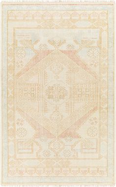 a beige and pink rug with an intricate design