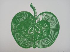 an apple drawn in green ink on white paper