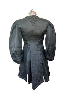 "19th Century- 1890s Womens Top Jacket with Tails. Beautiful! Silk and Satin and Lace.  This is such a rare jacket in such great shape. The lining is the only thing coming apart. Easy fix of just take out. Made by Kelly of Chicago.  Such attention to detail. Museum quality piece.  Puffed sleeves with detailed cuffs.  Button closure.  Wonderful condition you can definitely wear.  Womens Size: Small Measures:  32\" bust 32\" waist 32\" length" Victorian Dress With Long Sleeves And Historical Design, Regency Style Fitted Long Sleeve Outerwear, Regency Style Long Sleeve Costume Outerwear, Fitted Historical Design Outerwear With Long Sleeves, Victorian Long Sleeve Dress For Fall, Historical Victorian Dress With Buttons, Long Sleeve Victorian Dress For Fall, Vintage Victorian Dress With Buttons For Daywear, Historical Victorian Long Sleeve Dress For Fall