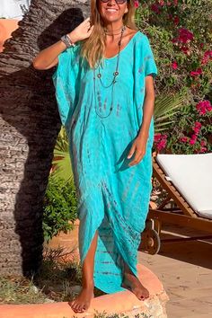 Bring the sunshine and endless summer vibes to any look with this delightful Short Sleeve Irregular Tie Dye Beach Kaftan Maxi Dress. Its whimsical tie-dye design will inspire you to take a much-needed break from the hustle and bustle of everyday life and just enjoy the moment. Brighten up any wardrobe with this sunshine-filled dress!Material:Cotton+PolyesterSIZEUS/CANBUSTWAISTHIPSS2-433"-34"26"-27"36"-37"M6-835"-36"28"-29"38"-39"L10-1237"-39"30"-32"40"-42"XL12-1440"-42"33"-35"43"-45" Blue Bohemian Resort Cover-up, Summer V-neck Maxi Dress With Batik Print, Summer Festival Dress With Asymmetrical Hem, Casual Tie-dye Maxi Dress For Beach Season, Casual Tie Dye Maxi Dress For Beach Season, Blue Short Sleeve Cover-up For Beach Party, Green Asymmetrical Hem Maxi Dress For Vacation, Blue Short Sleeve Beach Dress For Vacation, Flowy Maxi Dress With Asymmetrical Hem For Vacation