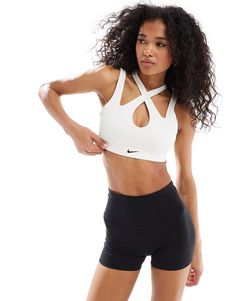 Sportswear by Nike Training Get the right support Suitable for low-impact activities Cross-over straps Nike logo print Pull-on style Modest Fashion Winter, Winter Party Dress, Petite Shirts, Nike Training, Jumpsuit Party, Long Sleeve Floral Dress, Satin Slip Dress, Sweaters And Leggings, Sport Bh