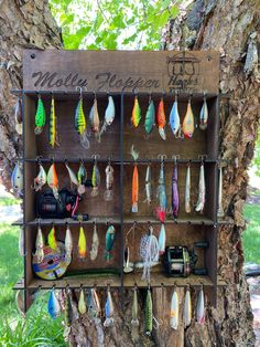 a tree with many different types of fishing lures hanging from it's hooks