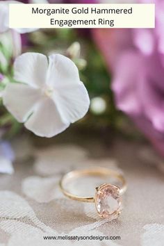 an engagement ring with the words morganite gold hammered engagement ring on it next to flowers