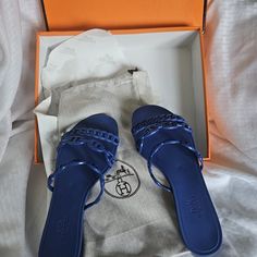 Herms Paris Beautiful Blue Jelly Flat Summer Sandals Italy Excellent Used Condition. Worn Just A Few Times. Sole Looks Brand New. I Have Taken Many Photos For An Accurate Description Of The Sandals Current Condition. Kept Both Sandals In One Dust Cover, As I Lost One Moving. By Way Of Pictures, The One Dust Gave Kept Them On Pristine Condition. Comes With The Orginal Box. If You Have Any Questions, Please Do Not Hesitate To Contact Me. I Would Be More Than Happy To Answer Any Questions. Happy Sh Summer Blue Sandals With Branded Heel Counter, Elegant Blue Flat Heel Sandals, Elegant Blue Flat Sandals, Luxury Blue Sandals For Summer, Designer Blue Sandals With Round Toe, Luxury Blue Sandals With Removable Insole, Elegant Blue Sandals For Vacation, Designer Blue Evening Sandals, Hermes Sandals