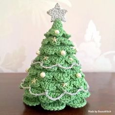 a crocheted christmas tree on a table