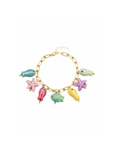 a bracelet with charms on it that include birds, fish and seashells in gold